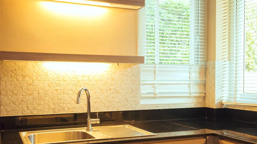 Kitchen sink with under cabinet lighting