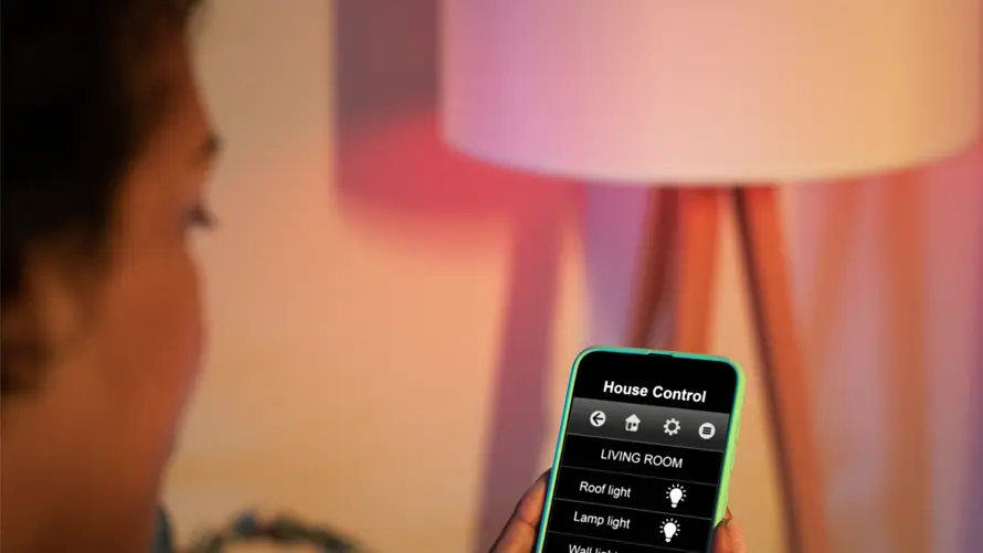 Woman adjusting smart light system